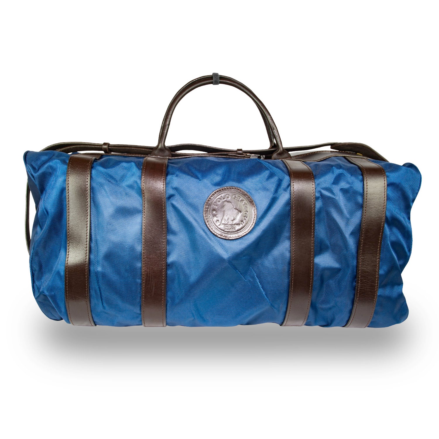 A Navy polo team bag with leather accents and the embossed Polo Gear logo, designed for carrying equipment and gear on the polo field.