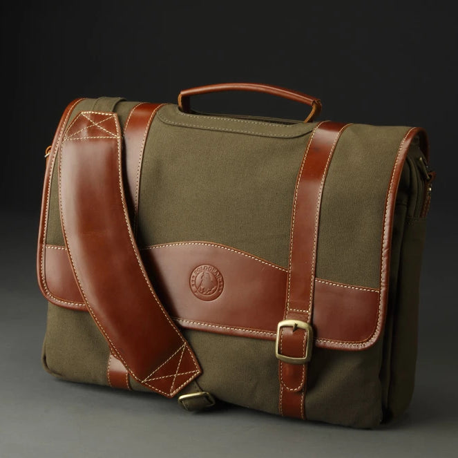 The beautiful and functional PoloGear Sheridan Leather COmputer Briefcase, featuring canvas and leather details. The padded shoulder strap is adjustable, and the brass hardware makes the bag a customer favorite. 